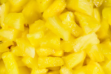 Pieces of chopped pineapple for the background