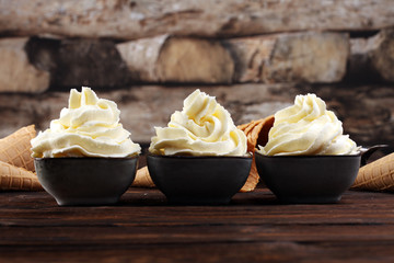 Vanilla soft served ice cream tasty sundae dairy ice cream on rustic background