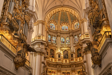 Obraz premium Golden decorations found inside the Cathedral of Granada. Elaborate ornamental grandeur used in the Granada Royal Cathedral, Spain