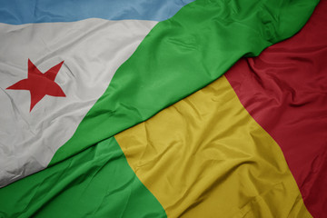 waving colorful flag of mali and national flag of djibouti.