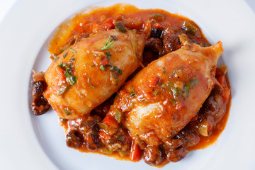 Stuffed squid with tomato sauce and vegetables