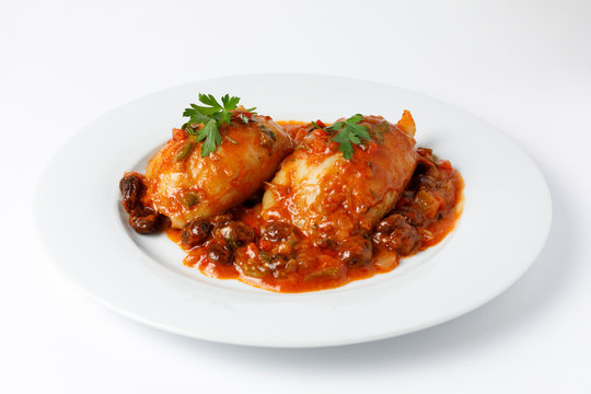 Stuffed squid with tomato sauce and vegetables