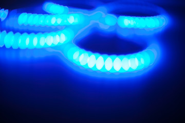 Blurry blue background of Christmas lights.