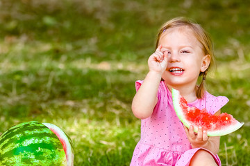 happy child with watermelon on nature in the park