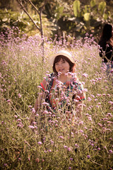 Asian woman happiness in the flower field.