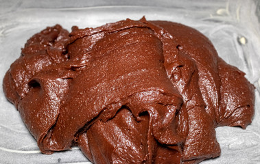Chocolate brownie dough in the form with flour in the background, Rio de Janeiro, Brazil