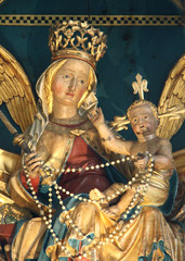 Obraz premium Madonna con Bambino; particolare di altare scolpito nella chiesa parrocchiale di Santa Maria Assunta a Velturno (Alto Adige)