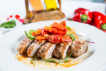 Roasted pork fillet with vegetables on a plate