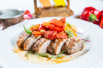 Roasted pork fillet with vegetables on a plate