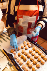 Lady making soy balls in a kitchen
