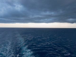 Cloudy weather behind a ship in the ocean