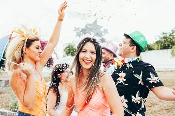 Brazilian Carnival. Group of Brazilian people in costume celebrating the carnival party in the city