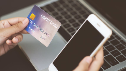 Hand, young woman using a smartphone, register to place an order Pay by credit card