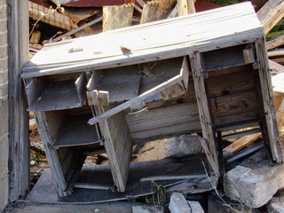 Fototapeta na wymiar Old Abandoned Desk Falling Apart Outside