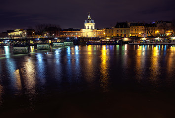 Fototapeta na wymiar Night view of Invalides and Seine river in Paris