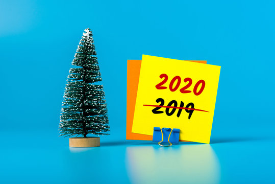 Business New Year concept - little Christmas tree with message 2020 is replacing 2019. Goals 2020