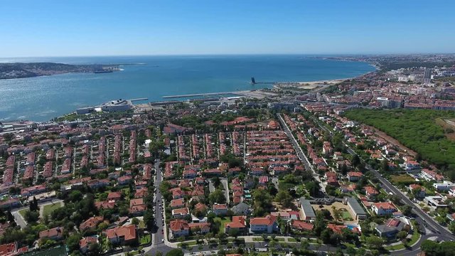 Lisbon cityscape river tagus belem Portugal aerial shot 4k