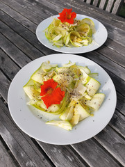 Starter - delicious vegetarian, raw food made of squash, parmesan, lemon, black pepperr etc.