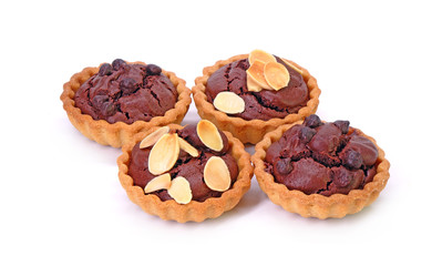 Chocolate tarts topping with sliced almonds and chocolate chips, Isolated on white background.