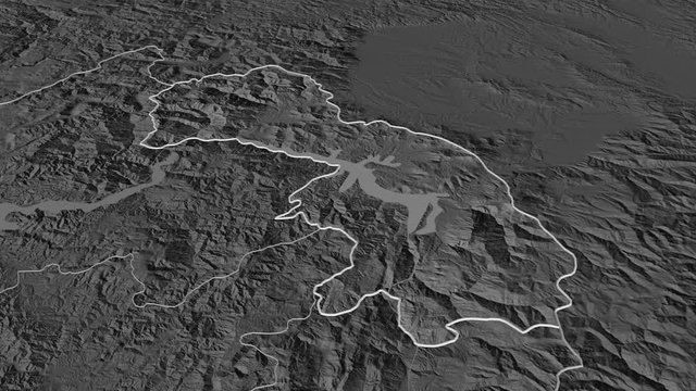 Kuk&euml;s, county with its capital, zoomed and extruded on the bilevel map of Albania in the conformal Stereographic projection. Animation 3D