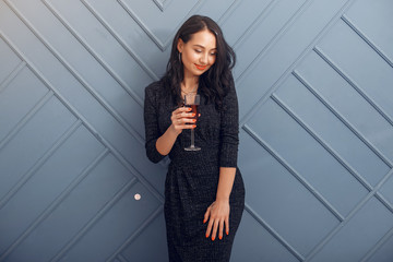 Girl in a studio. Party theme. Lady in a elegant dress