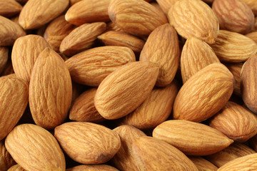 A heap of raw almonds. Closeup. Macro