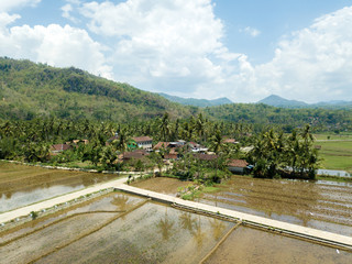 aerial view of village in a valley with nice field view under the mountains