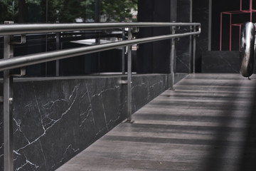 dark gray ramp with metal handles