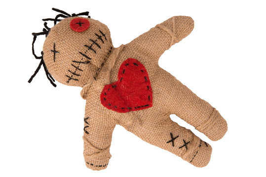Voodoo doll with in burlap fabric, isolated on white background. Directly above. Cut out.