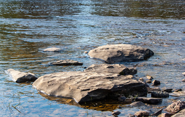 Fototapeta na wymiar Rocks in running water