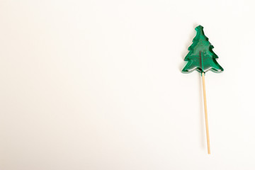 Christmas tree green lollipop on a stick