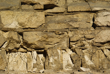 Fototapeta premium A brick wall broken by everyday life