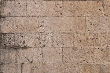 Background texture of the old fortress stone wall. Conceptual background for designers. Selective focus.