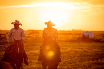 Fototapeta na wymiar Cowboys at Sunrise