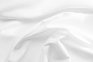 Abstract white fabric texture background. Cloth soft wave. Creases of satin, silk, and cotton.	