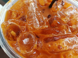 Thai milk tea sweet Cold drink on a table.