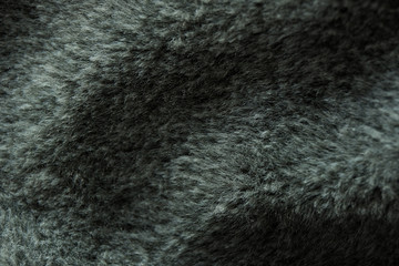 beautiful black gray fur background, fake animal fur background, texture of wavy cloth with soft hair black color, close up furry texture background dark gray color, Luxurious wool texture background