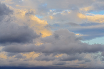 Dramatic puffy clouds isolated against blue skies