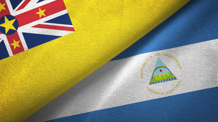 Niue and Nicaragua two flags textile cloth, fabric texture