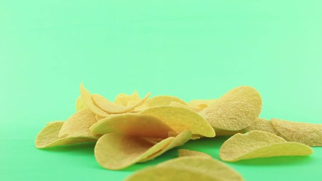 potato chips fall on green screen