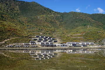 Fototapeta na wymiar Hotel near Napa Hai Nature Reserve a plateau lake Shangri-La Yunnan China