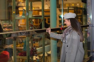 Woman looking at items on display in a showcase