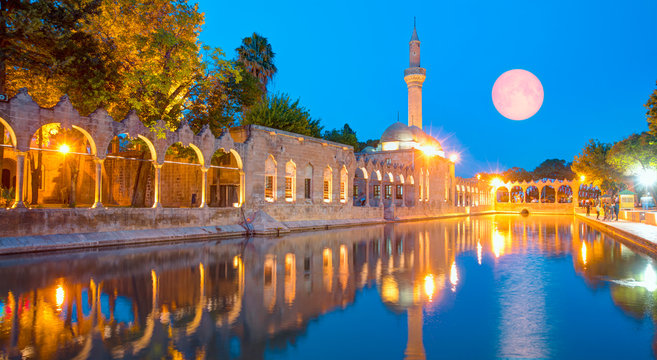Halil-ur Rahman Mosque and Holy lake with full moon in Golbasi Park - Urfa, Turkey "Elements of this image furnished by NASA "