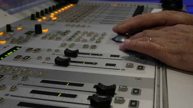Broadcast audiomix, Soundboard knobs. sound engineer presses the keys, moves the buttons. Closeup Portugal