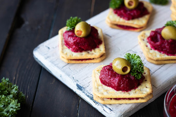 Beetroot relish on crackers. An original party snack.