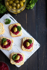 Beetroot relish on crackers. An original party snack.