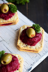 Beetroot relish on crackers. An original party snack.