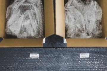 original product vs dupe imitation label inside delivery parcel boxes from online purchases