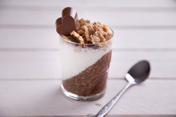 Delicious breakfast, cocoa chia pudding with yogurt and cereals