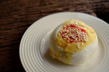 1 beautiful Chinese spring roll pastry, sprinkled with sesame seeds in a lovely white ceramic dish